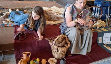 Mother and daughter doing traditional crafts