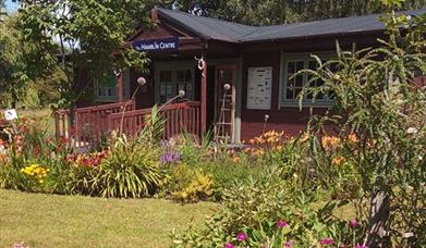 The Hamblin Centre from outside with surrounding gardens with flowers