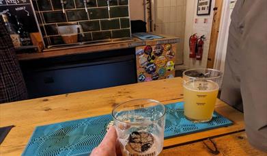 a drink on the bar at The Escapist