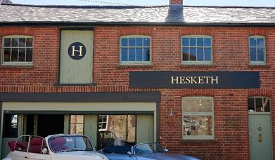 Hesketh Antiques with classic cars in front