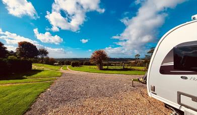 A view of fields from a caravan
