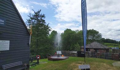 a fountain of water created by Coultershaw beam pump near Petworth, Sussex