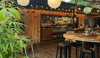 a view of the Crate Cafe with fairy lights and outdoor seating