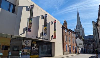 The Novium Museum from the outside, with Chichester Cathedral in the background.
