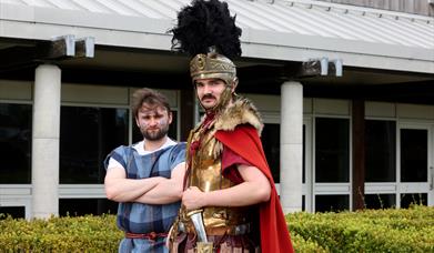 A Celtic Warrior and Roman Centurion stand side by side