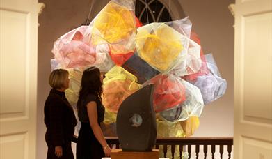 People in Pallant House Gallery at night