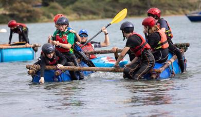 children in water on rafts