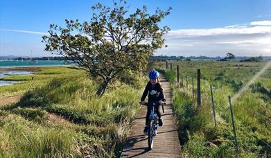 Girl on bike on Salterns Way