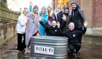 a group of people by a bath tub