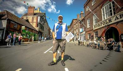 a tour guide standing in the town of Arundel