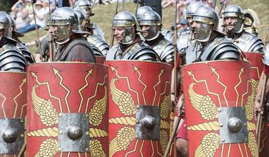 Roman soldier re-enacters standing together