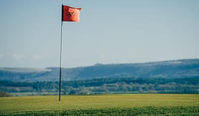 A golf flag at Cowdray golf course