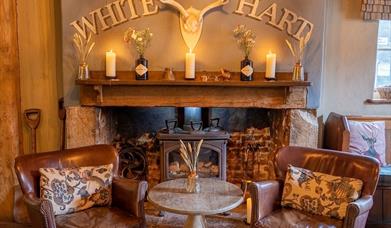 a cosy fireside at The White Hart in South Harting