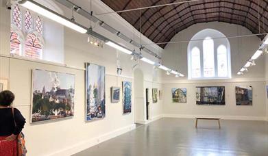 Interior of Oxmarket Comtemporary set in a former Church with artworks on the walls